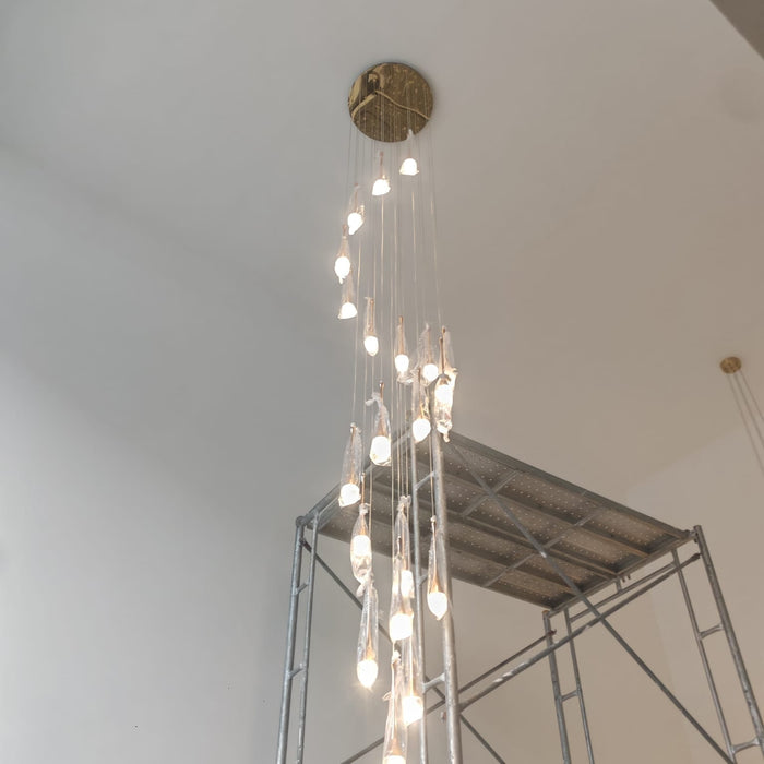 September 2026 DWHOME installation featuring Alabaster Lunar and Raindrop Chandeliers