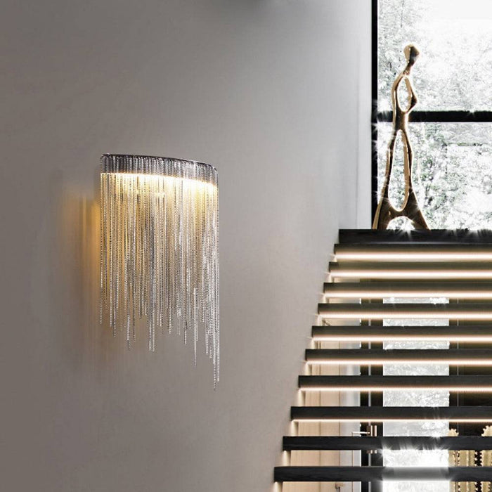 Cadena Tassel Wall Sconce.