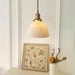 Brass Pleated Ceramic Pendant Lamp.