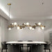 Eli Glass Globes Linear Chandelier For Dining Room.