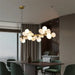 Eli Glass Globes Linear Chandelier For Dining Room.