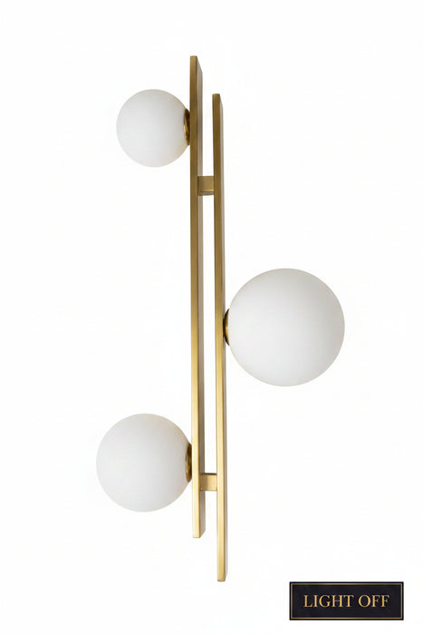 Gold handle with white knobs on a wooden door