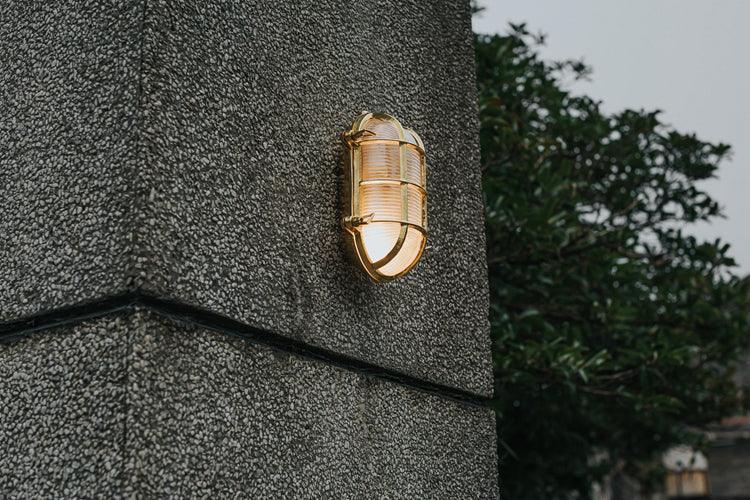 Nautilus Oval brass cage outdoor wall light / ceiling Light.