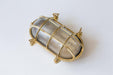 Nautilus Oval brass cage outdoor wall light / ceiling Light.