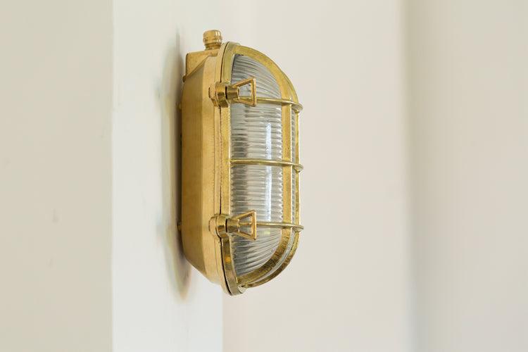 Nautilus Oval brass cage outdoor wall light / ceiling Light.