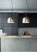 Kemi loft minimalist monochrome pendant light with strap handle.