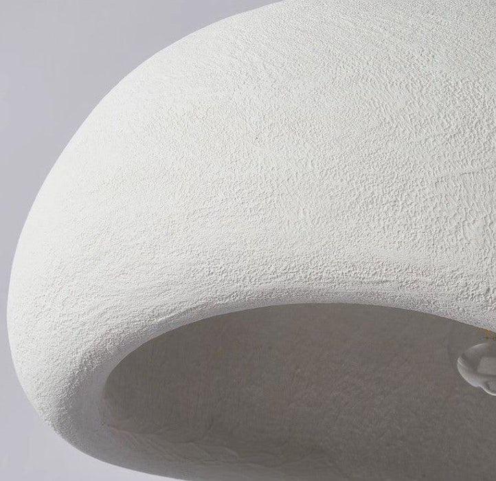 Stucco textured pebble stone plaster pendant light.