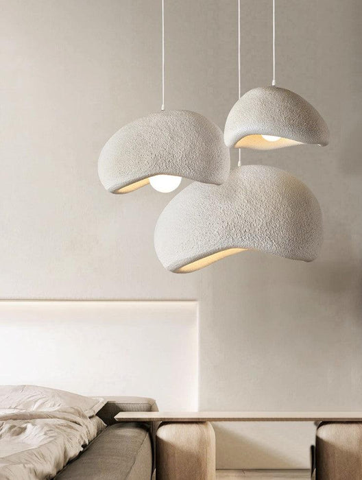 Stucco textured pebble stone plaster pendant light.