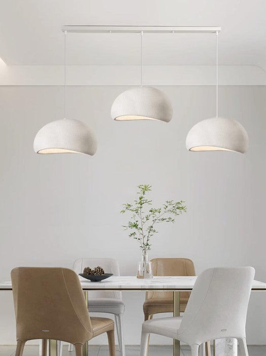 Stucco textured pebble stone plaster pendant light.