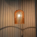 Wooden bird cage pendant light.