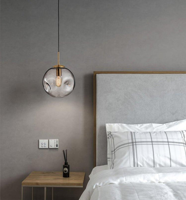 Aminta Dimpled Glass Shade Brass Pendant Light.