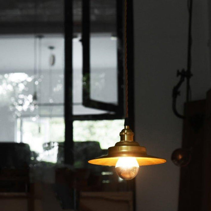 Cedric gold industrial pendant light.