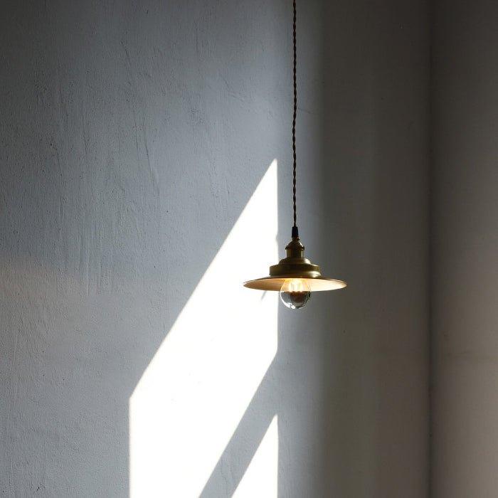 Cedric gold industrial pendant light.