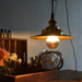 Cedric gold industrial pendant light.