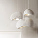 Stucco textured pebble stone plaster pendant light.