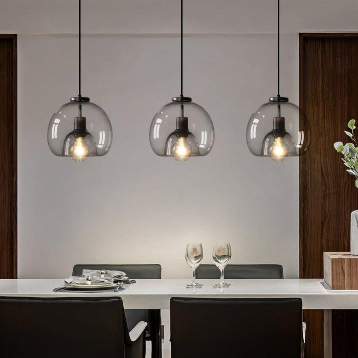 Enzo minimalist curve tinted glass shade pendant light.