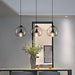 Enzo minimalist curve tinted glass shade pendant light.