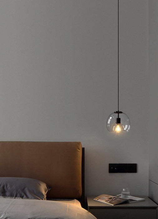 Enzo minimalist curve tinted glass shade pendant light.