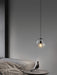 Enzo minimalist curve tinted glass shade pendant light.