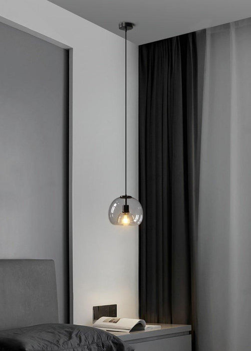 Enzo minimalist curve tinted glass shade pendant light.